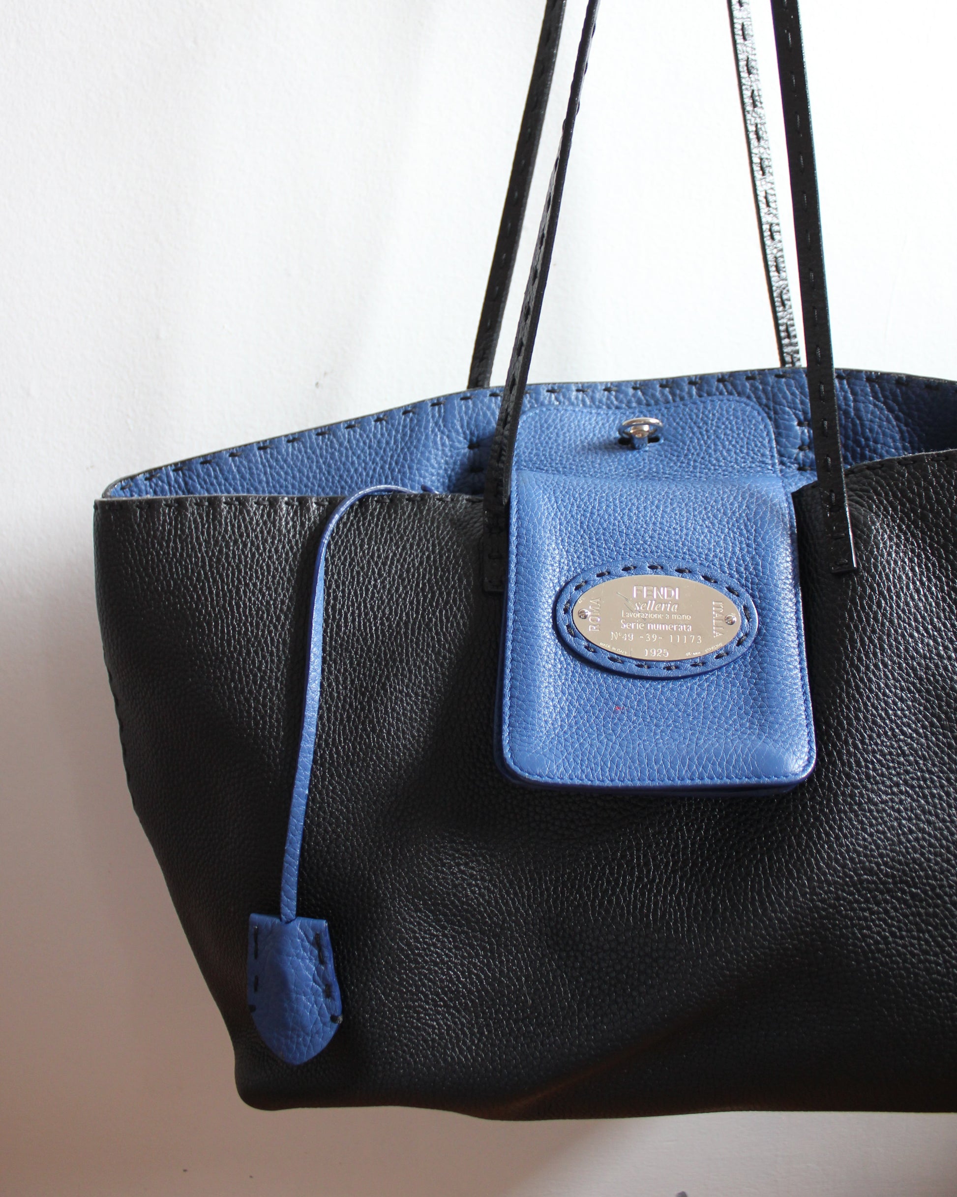 Fendi selleria black pebbled leather exterior and blue interior.
