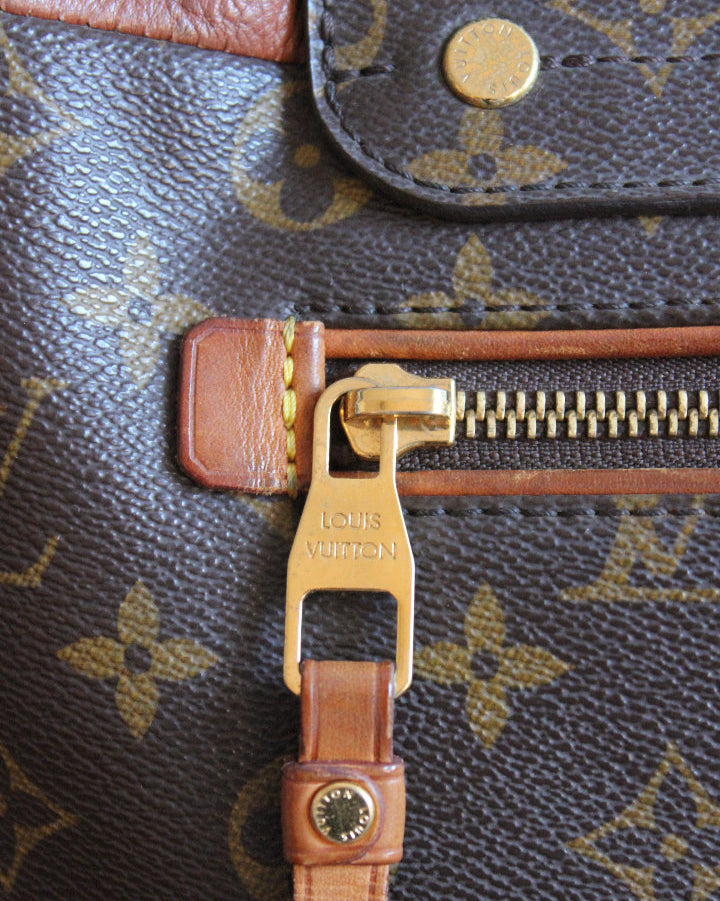 Louis Vuitton monogram olympe zipper