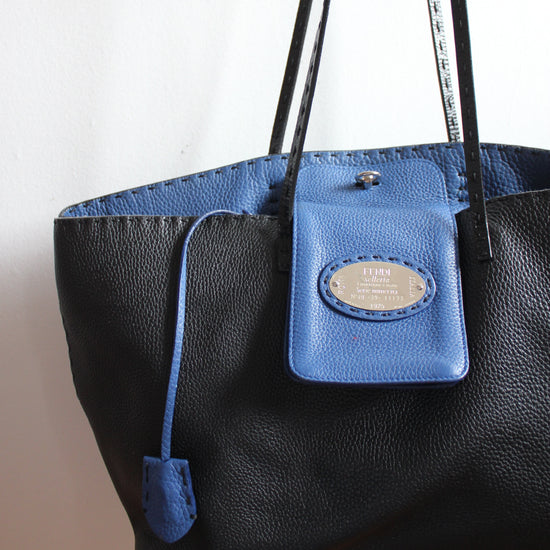 Fendi selleria black pebbled leather exterior and blue interior. 