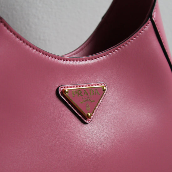 enamelled pin on large pink cleo prada bag 1BC179